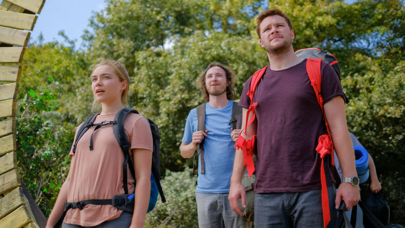 Dani, Pelle, and Christian arrive at the village.
